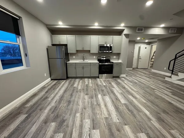a view of kitchen with microwave and stove