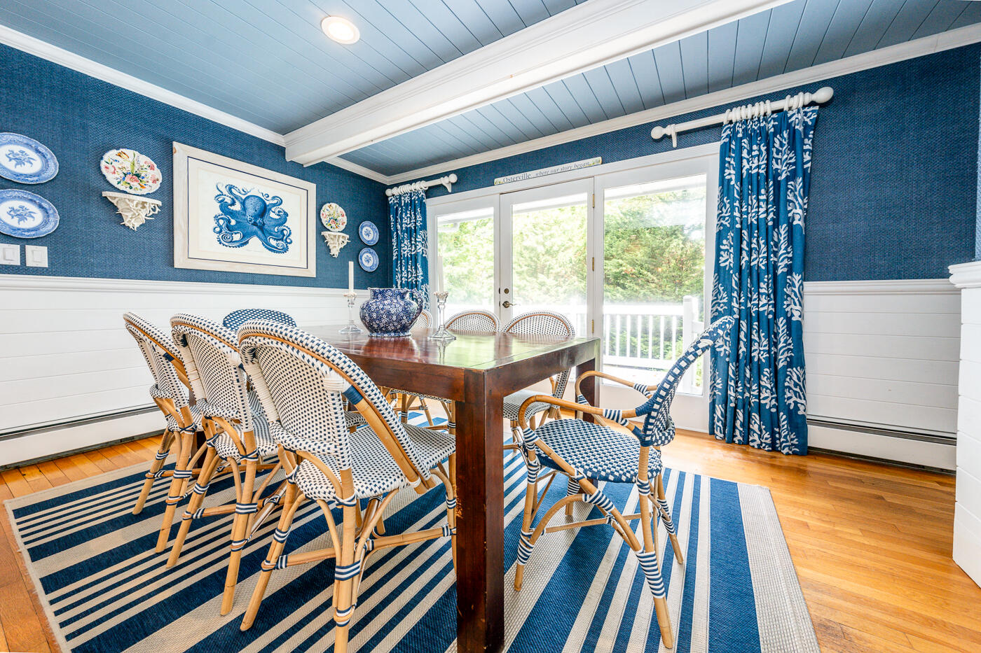 46 Sea Marsh Road Centerville, MA 02632 - Photo 18 of 69 a view of a dining room with furniture wooden floor and a chandelier