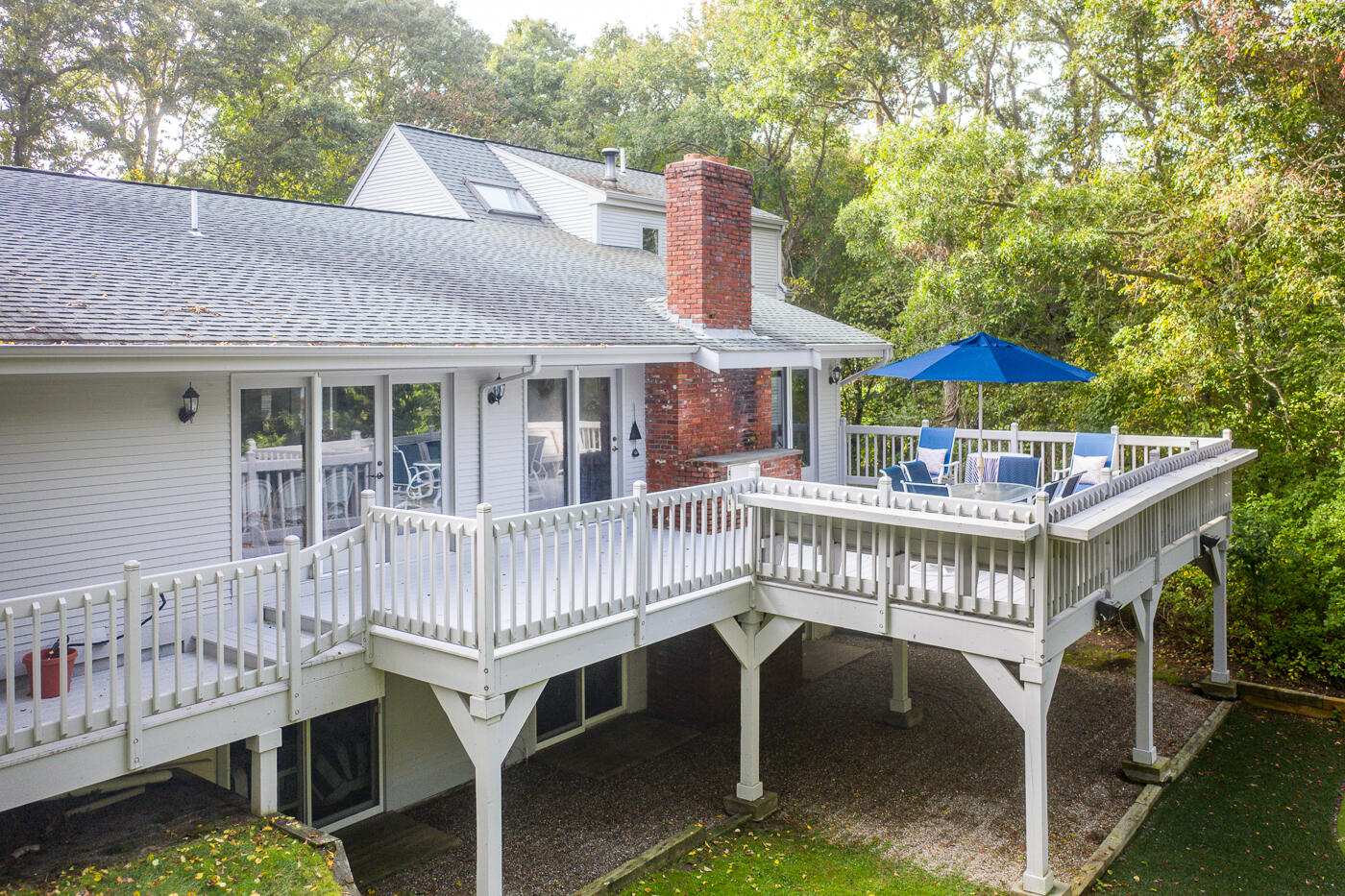46 Sea Marsh Road Centerville, MA 02632 - Photo 57 of 69 a view of a house with a deck and furniture