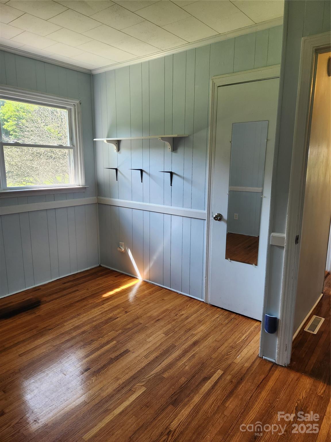 490 South Moose Road Mount Pleasant, NC 28124 - Photo 15 of 16 a room with wooden floor and window