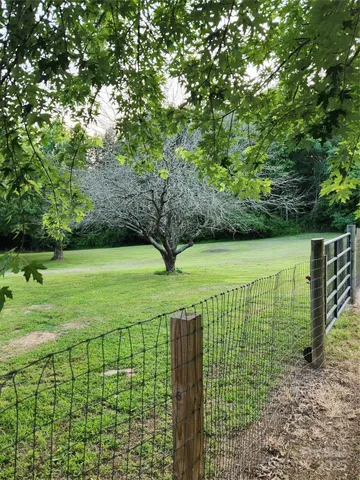 a view of a golf course with a lake view