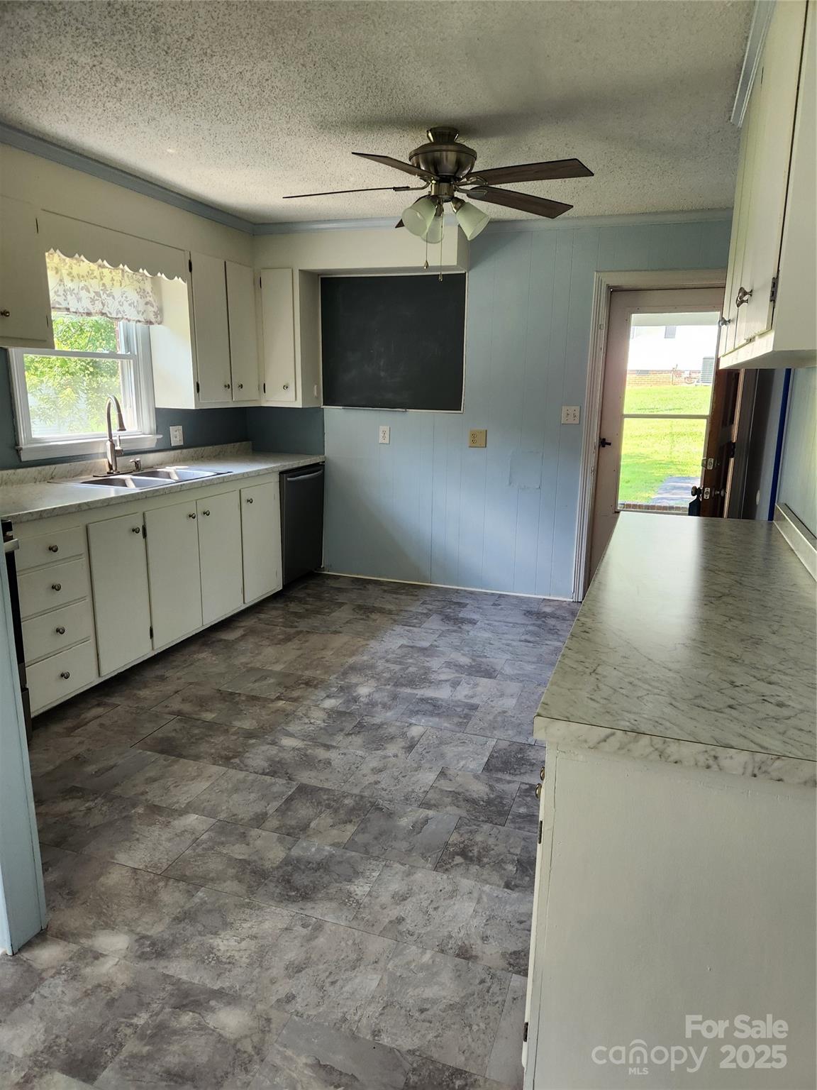 490 South Moose Road Mount Pleasant, NC 28124 - Photo 8 of 16 a view of a kitchen with a sink and dishwasher cabinets