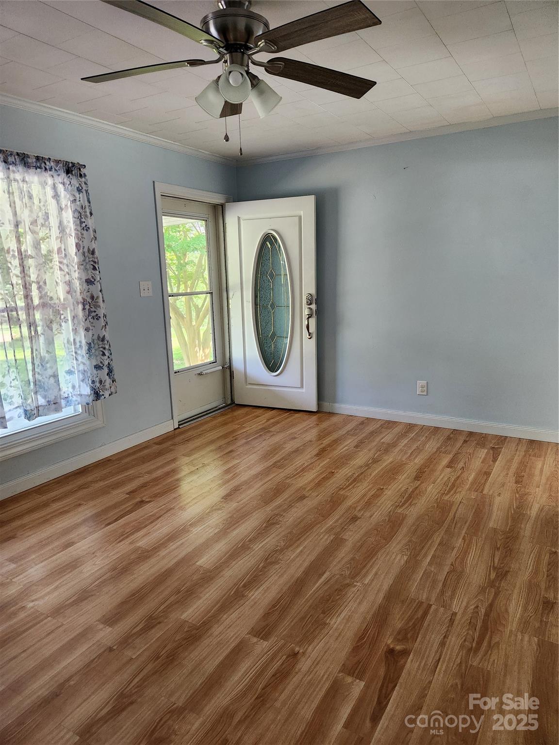 490 South Moose Road Mount Pleasant, NC 28124 - Photo 10 of 16 a view of a livingroom with wooden floor and a large window