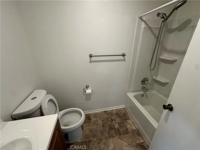 a bathroom with a sink and toilet
