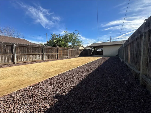 a view of swimming pool with a backyard