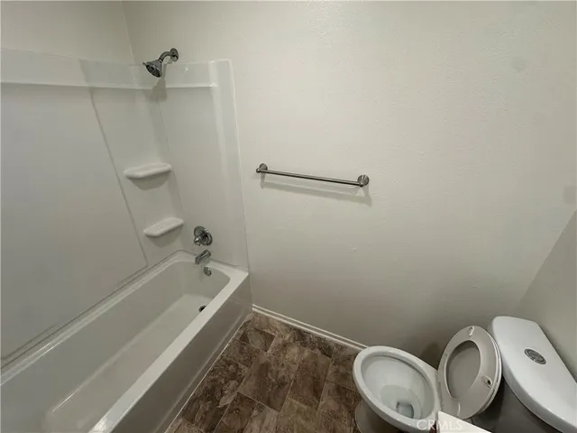 a bathroom with a sink a toilet and bathtub