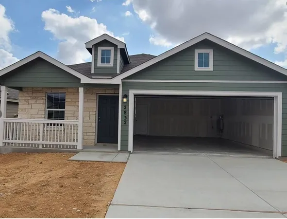 a front view of a house with garage