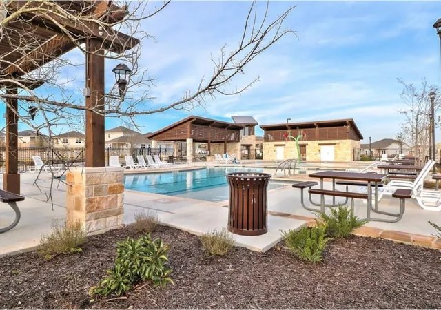a living room with table and chairs