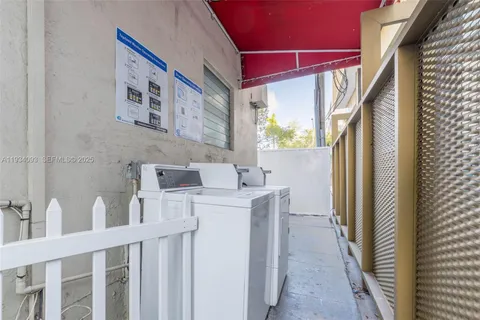 a view of a door and an chairs in the house