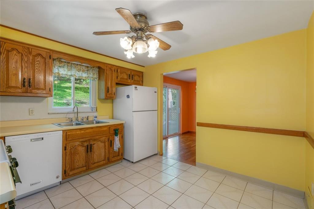 100 Longvue Drive Pittsburgh, PA 15237 - Photo 7 of 25 a view of a kitchen with a refrigerator washer and dryer