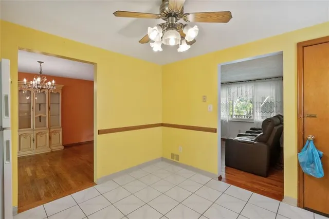 a kitchen with stainless steel appliances granite countertop a refrigerator a stove and a sink