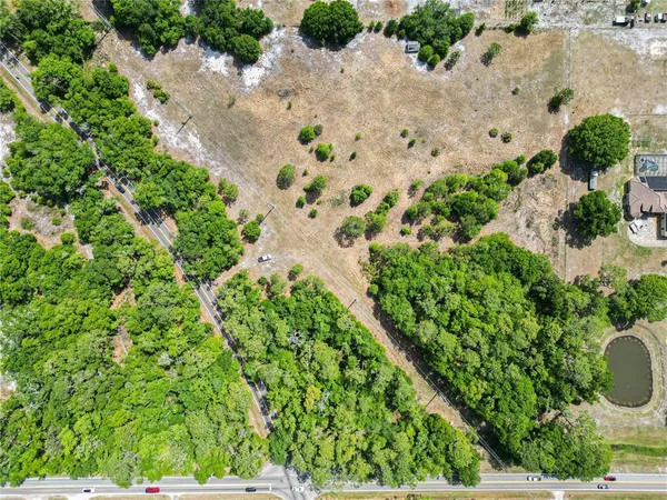 a view of backyard with a table and chairs