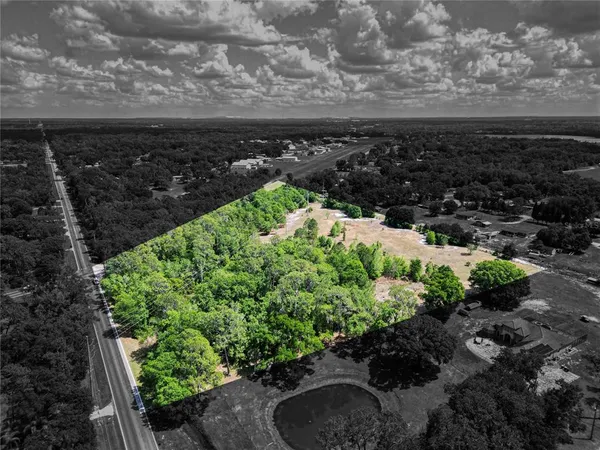 a view of a pathway with a garden