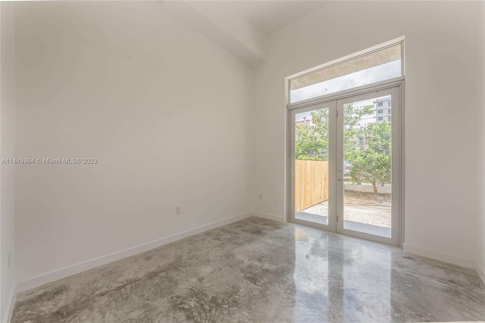 771 Northwest 1st Street, Unit 201 Miami, FL 33128 - Photo 21 of 34 a view of an empty room with a window