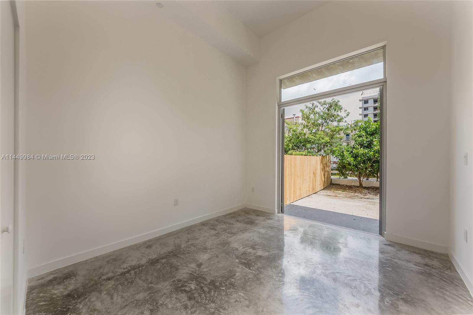 771 Northwest 1st Street, Unit 201 Miami, FL 33128 - Photo 24 of 34 an empty room with windows