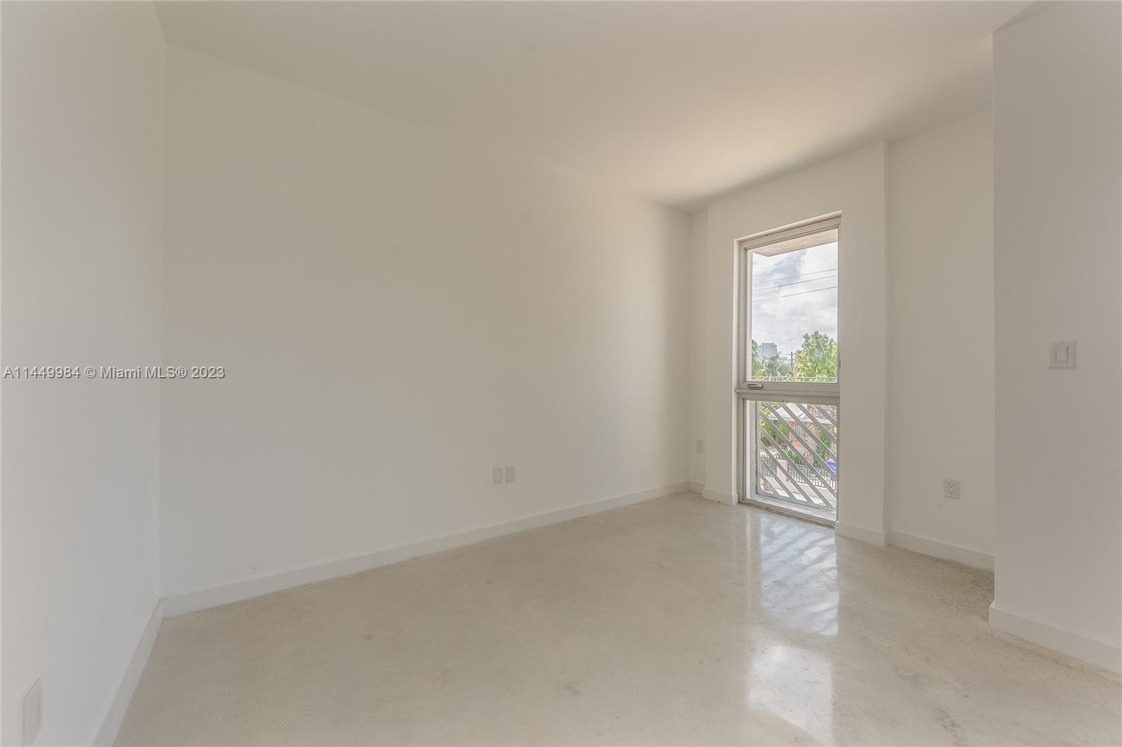 771 Northwest 1st Street, Unit 201 Miami, FL 33128 - Photo 26 of 34 a view of an empty room and window