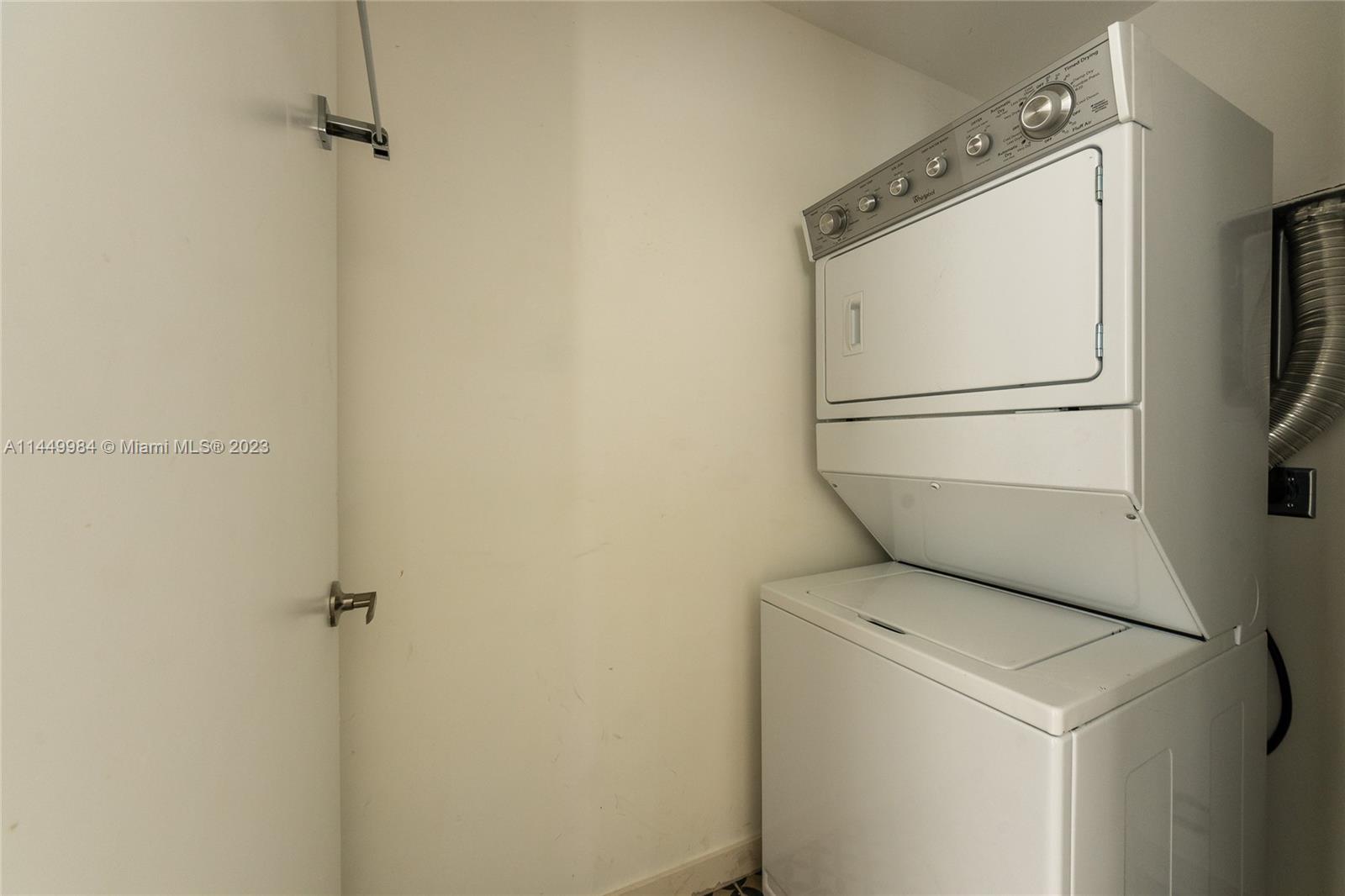 771 Northwest 1st Street, Unit 201 Miami, FL 33128 - Photo 31 of 34 a utility room with dryer and washer