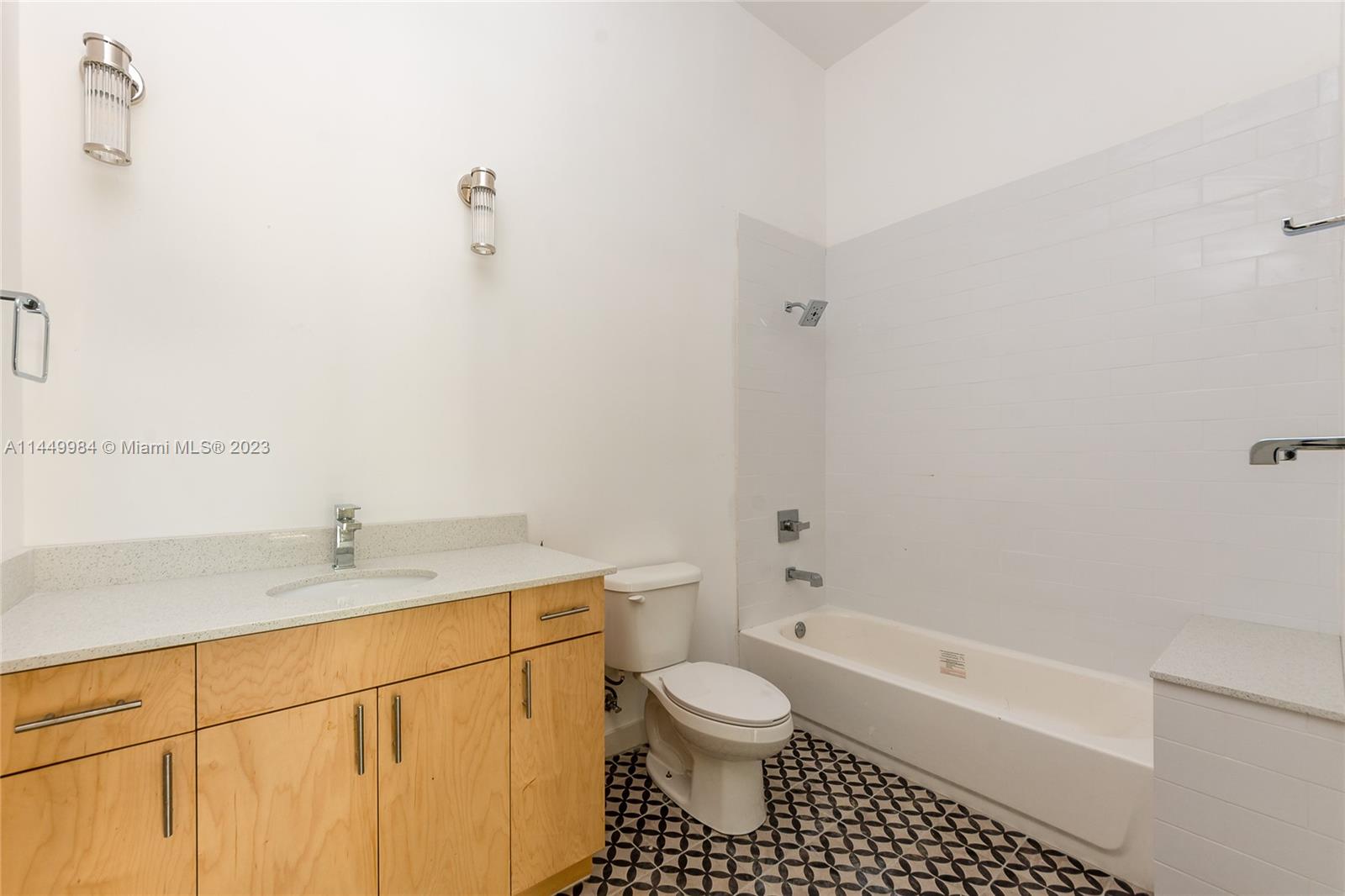 771 Northwest 1st Street, Unit 201 Miami, FL 33128 - Photo 33 of 34 a bathroom with a sink toilet and shower