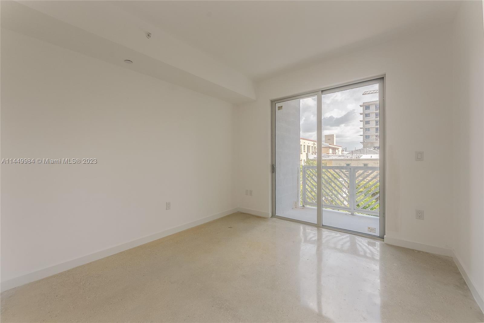 771 Northwest 1st Street, Unit 201 Miami, FL 33128 - Photo 34 of 34 an empty room with windows