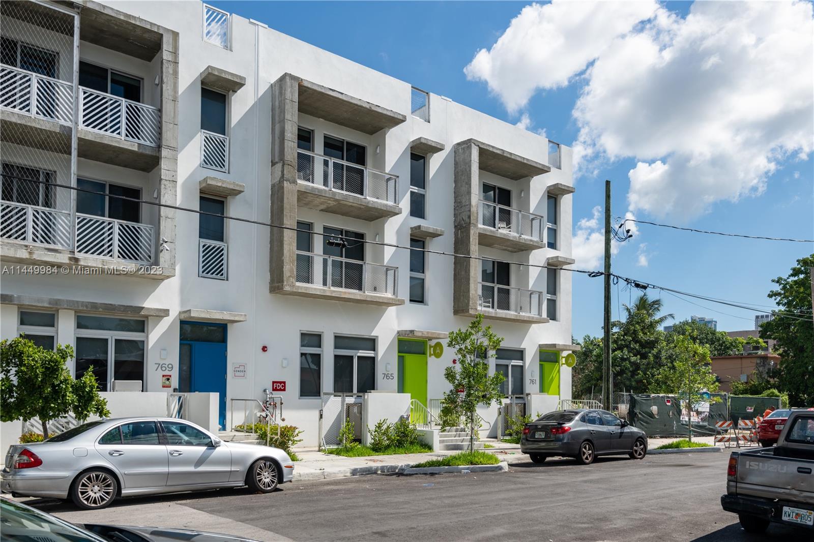771 Northwest 1st Street, Unit 201 Miami, FL 33128 - Photo 5 of 34 a car parked in front of a building