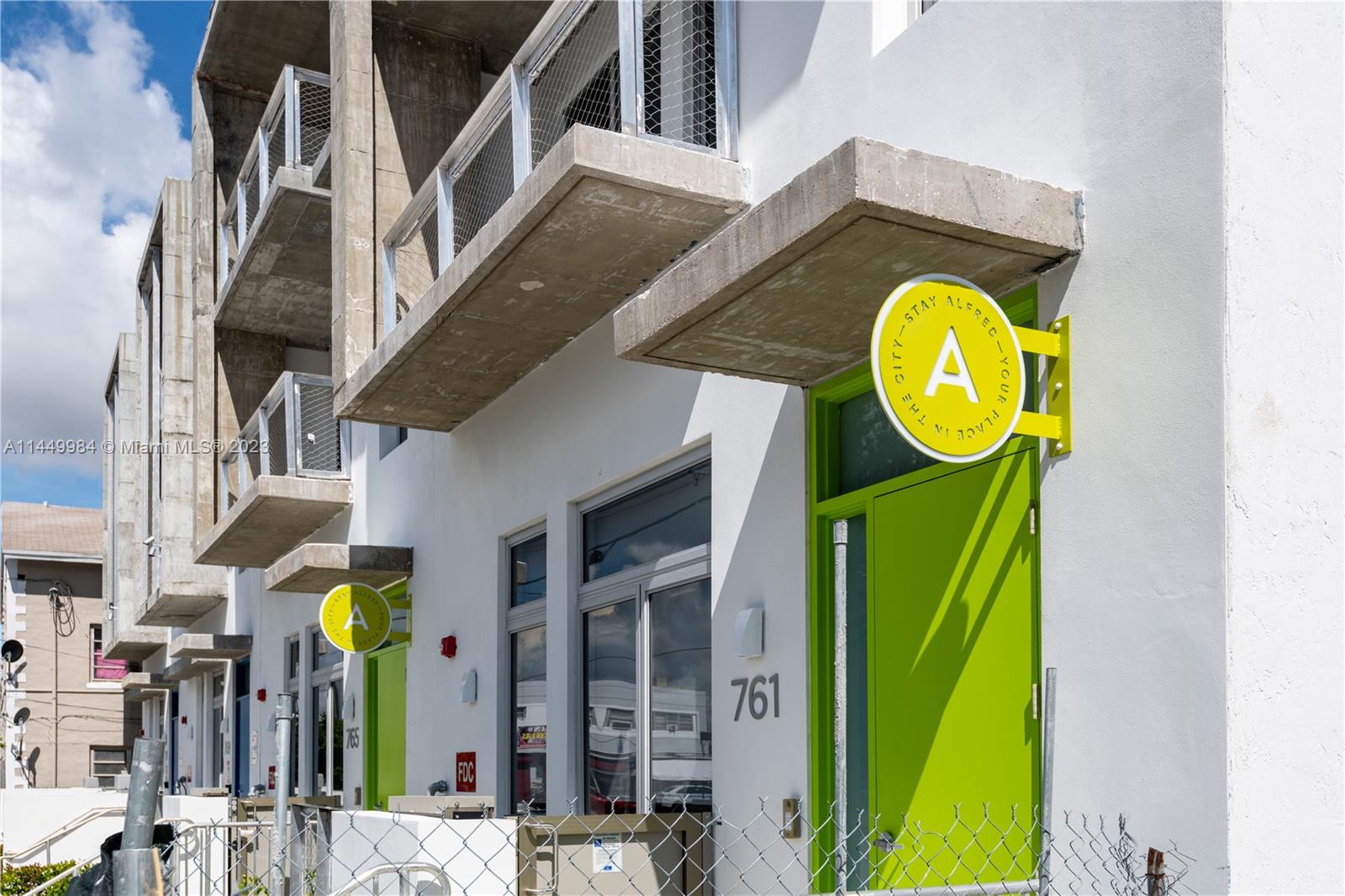 771 Northwest 1st Street, Unit 201 Miami, FL 33128 - Photo 9 of 34 a view of a building with street