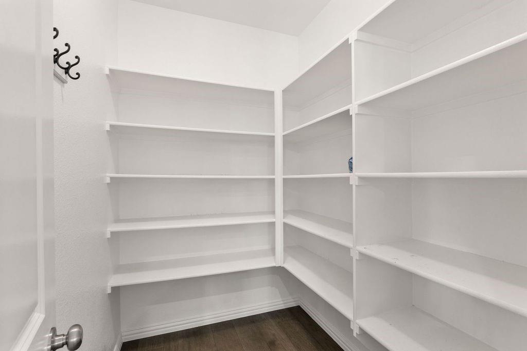 1636 Hydrangea Lane Prosper, TX 75078 - Photo 19 of 31 a view of walk in closet with empty racks