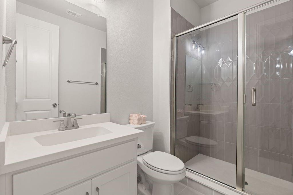 1636 Hydrangea Lane Prosper, TX 75078 - Photo 23 of 31 a bathroom with a sink toilet and shower