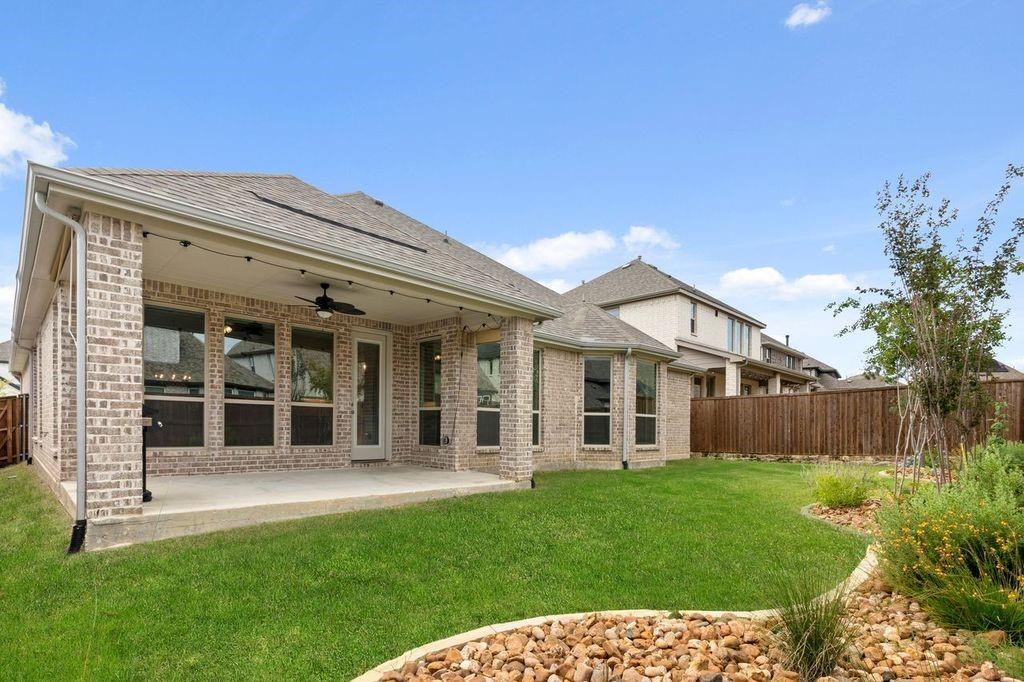 1636 Hydrangea Lane Prosper, TX 75078 - Photo 29 of 31 front view of a house with a yard
