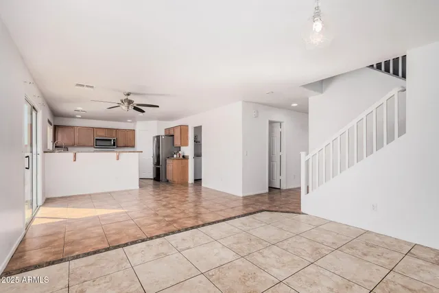 a view of a kitchen with a sink and a living room