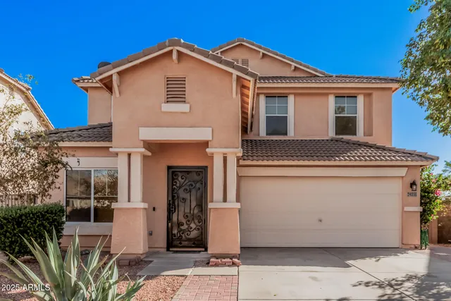 a front view of a house with a garage