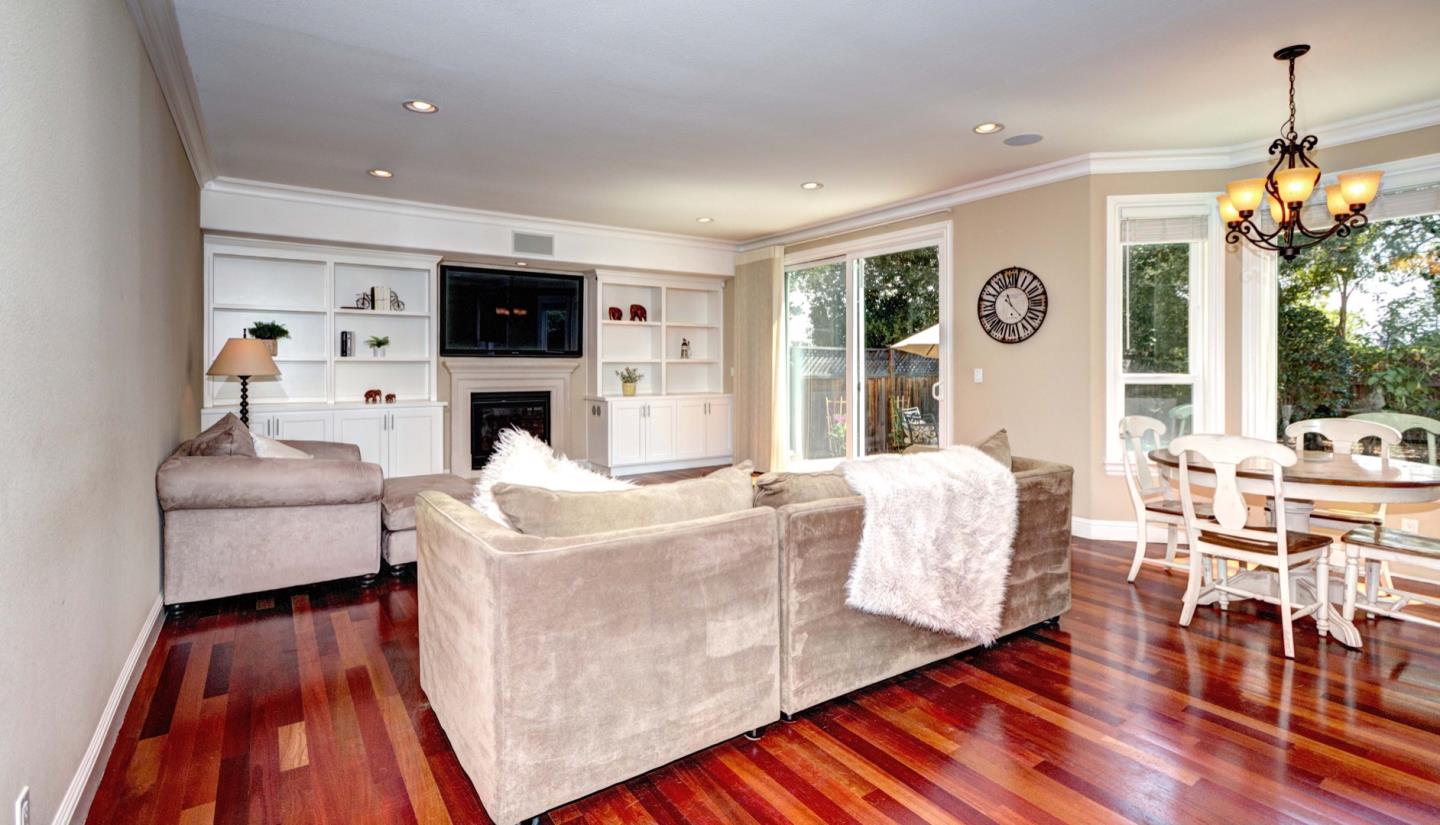 5408 Taft Drive San Jose, CA 95124 - Photo 14 of 26 a living room with furniture a flat screen tv and a fireplace