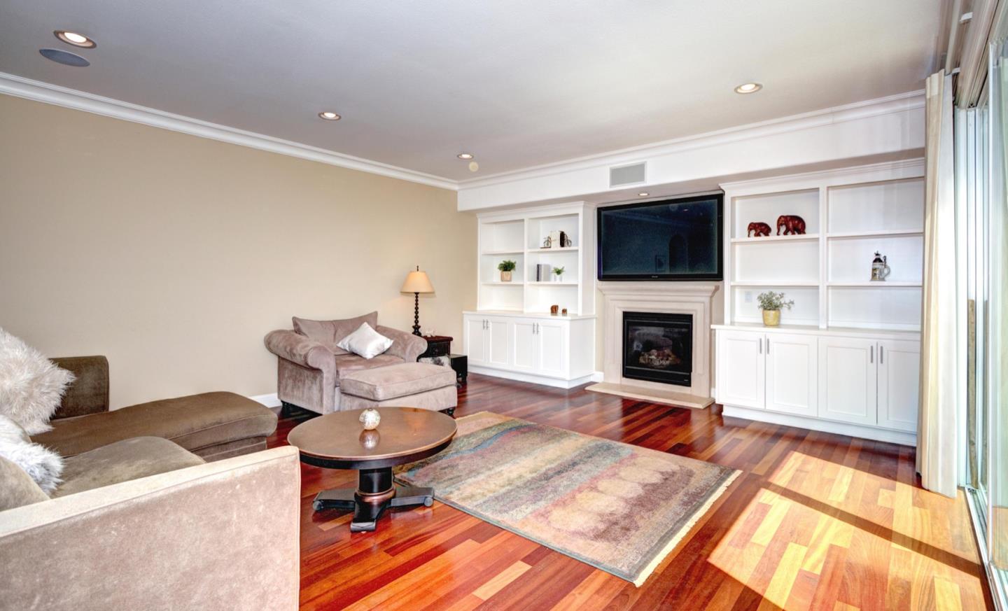 5408 Taft Drive San Jose, CA 95124 - Photo 15 of 26 a living room with furniture a flat screen tv and a fireplace