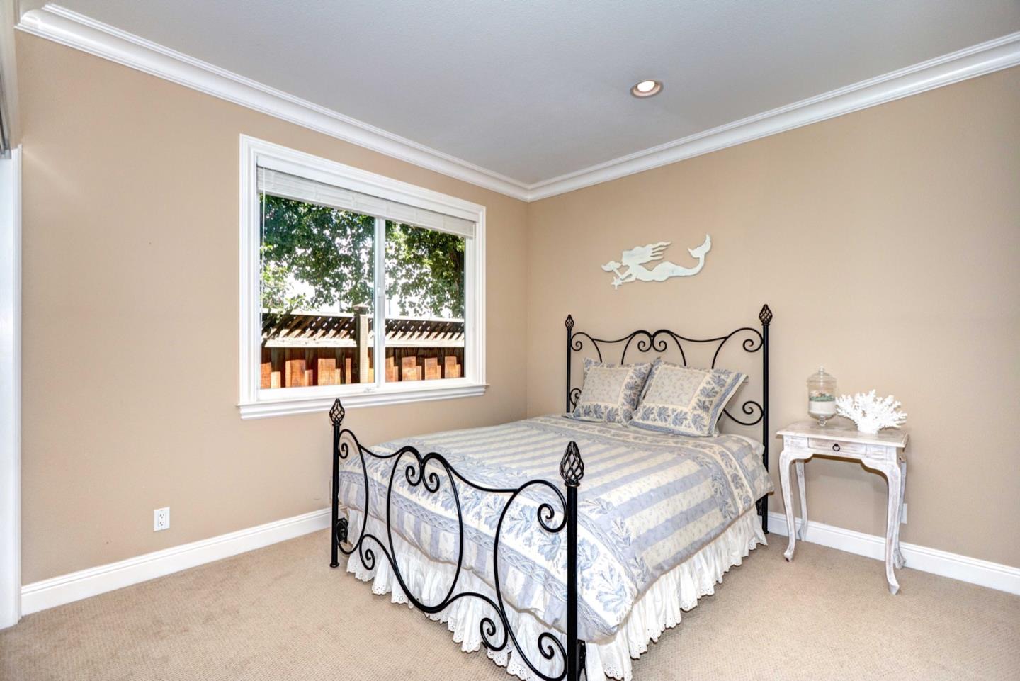 5408 Taft Drive San Jose, CA 95124 - Photo 17 of 26 a bedroom with a bed and a window