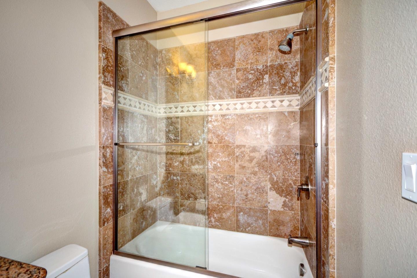 5408 Taft Drive San Jose, CA 95124 - Photo 19 of 26 a bathroom with a bathtub and a shower