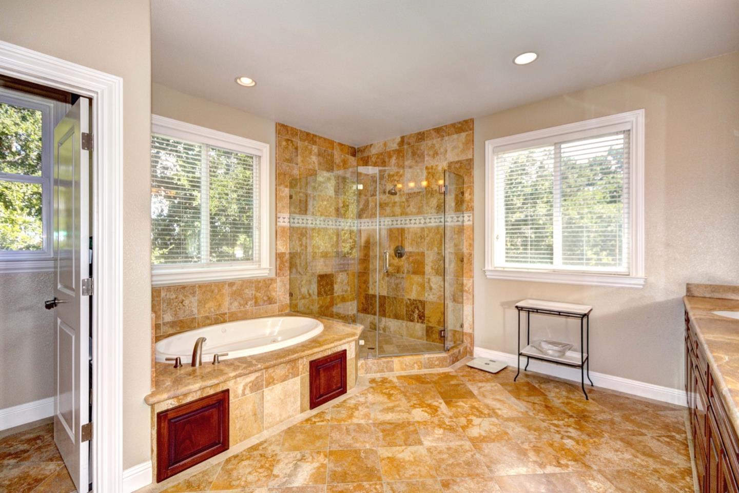 5408 Taft Drive San Jose, CA 95124 - Photo 23 of 26 a spacious bathroom with a tub sink and mirror