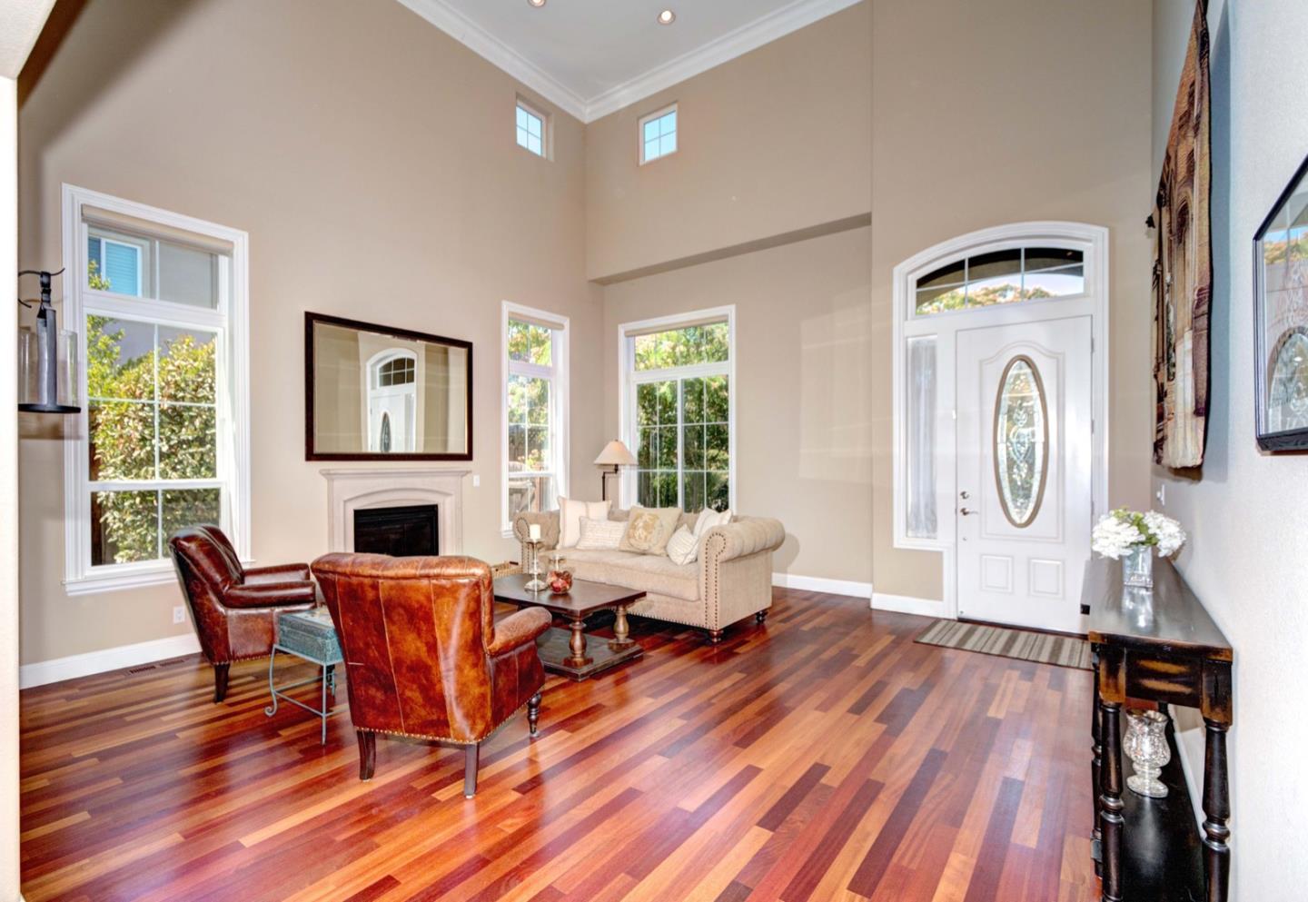 5408 Taft Drive San Jose, CA 95124 - Photo 4 of 26 a living room with furniture a fireplace and wooden floor next to a window