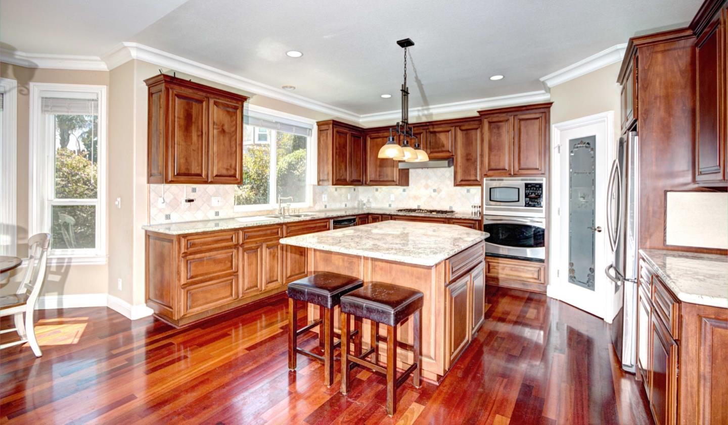 5408 Taft Drive San Jose, CA 95124 - Photo 10 of 26 a kitchen with a sink stove and wooden floor