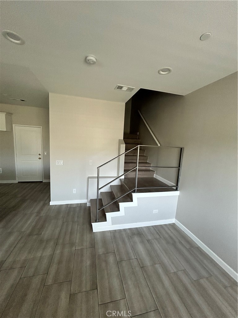 13665 Arrow Route, Unit 9 Fontana, CA 92335 - Photo 19 of 43 a view of entryway and hall with wooden floor