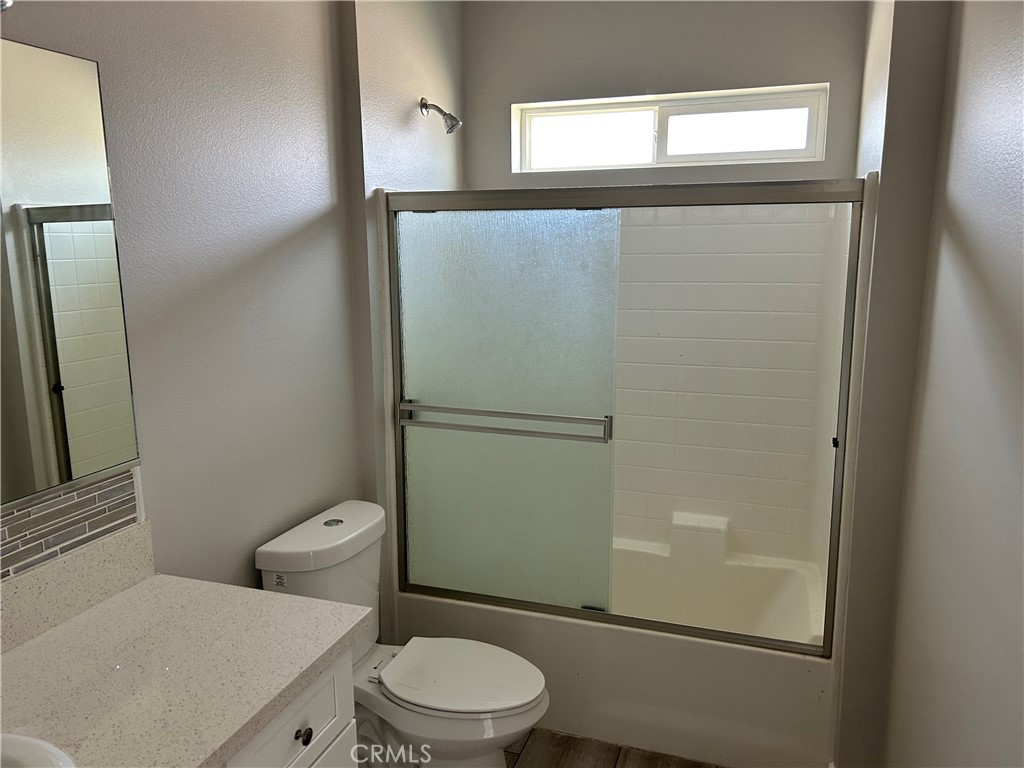 13665 Arrow Route, Unit 9 Fontana, CA 92335 - Photo 30 of 43 a bathroom with a toilet a sink and shower