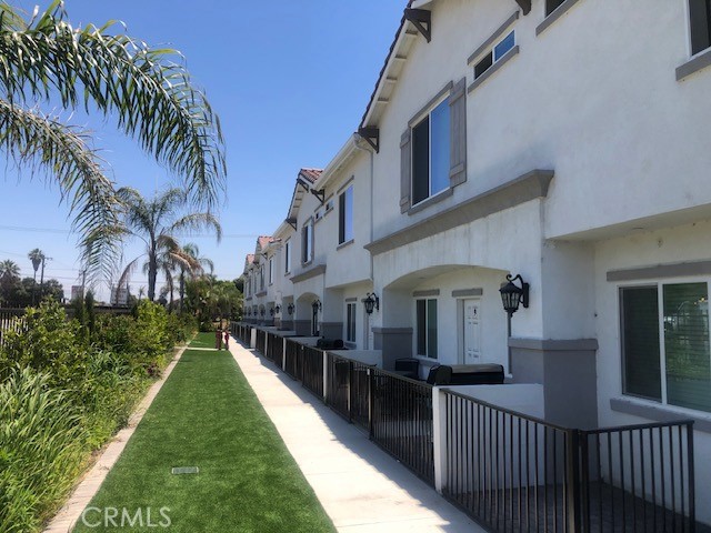 13665 Arrow Route, Unit 9 Fontana, CA 92335 - Photo 34 of 43 a view of a house with a yard