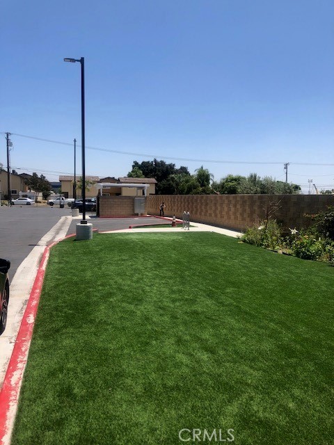13665 Arrow Route, Unit 9 Fontana, CA 92335 - Photo 38 of 43 a view of a house with a big yard and a big yard