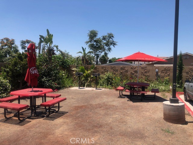 13665 Arrow Route, Unit 9 Fontana, CA 92335 - Photo 40 of 43 an outdoor space with patio and furniture