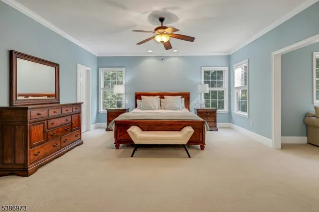 a spacious bathroom with a tub a sink and mirror