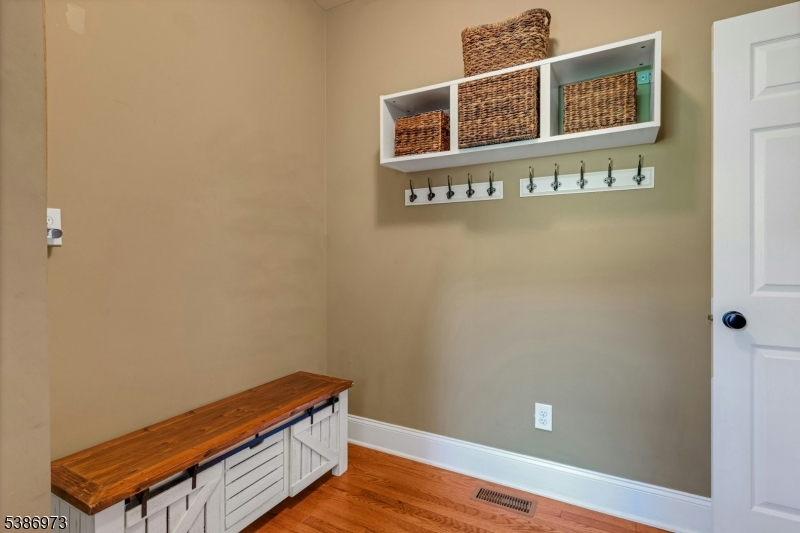 33 Chancellor Way Long Valley, NJ 07853 - Photo 19 of 42 a view of a room with an empty space and wooden floor