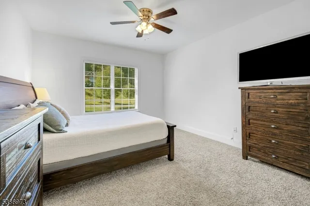 a bedroom with a bed and a chair