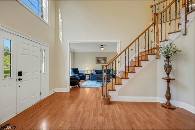 33 Chancellor Way Long Valley, NJ 07853 - Photo 4 of 42 a view of entryway and hall with wooden floor