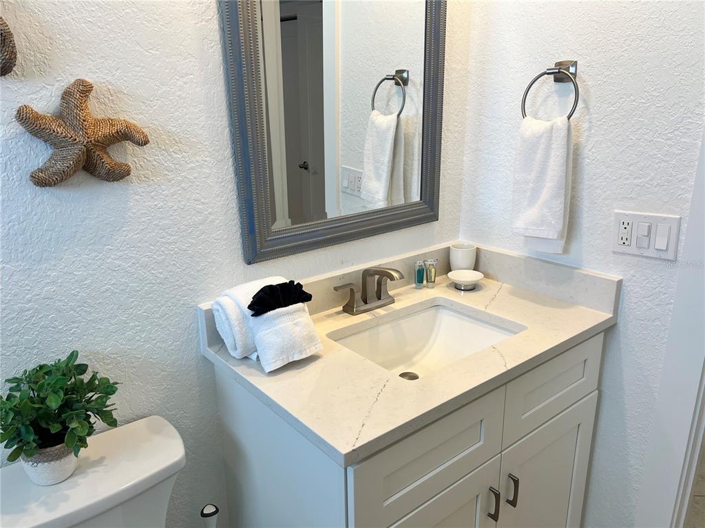 6154 Midnight Pass Road, Unit B11 Sarasota, FL 34242 - Photo 13 of 15 a bathroom with a sink and a mirror