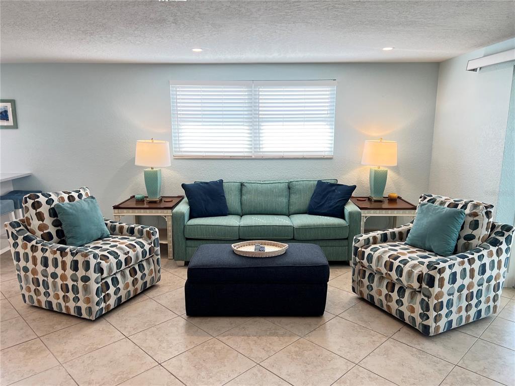 6154 Midnight Pass Road, Unit B11 Sarasota, FL 34242 - Photo 4 of 15 a living room with furniture and a window
