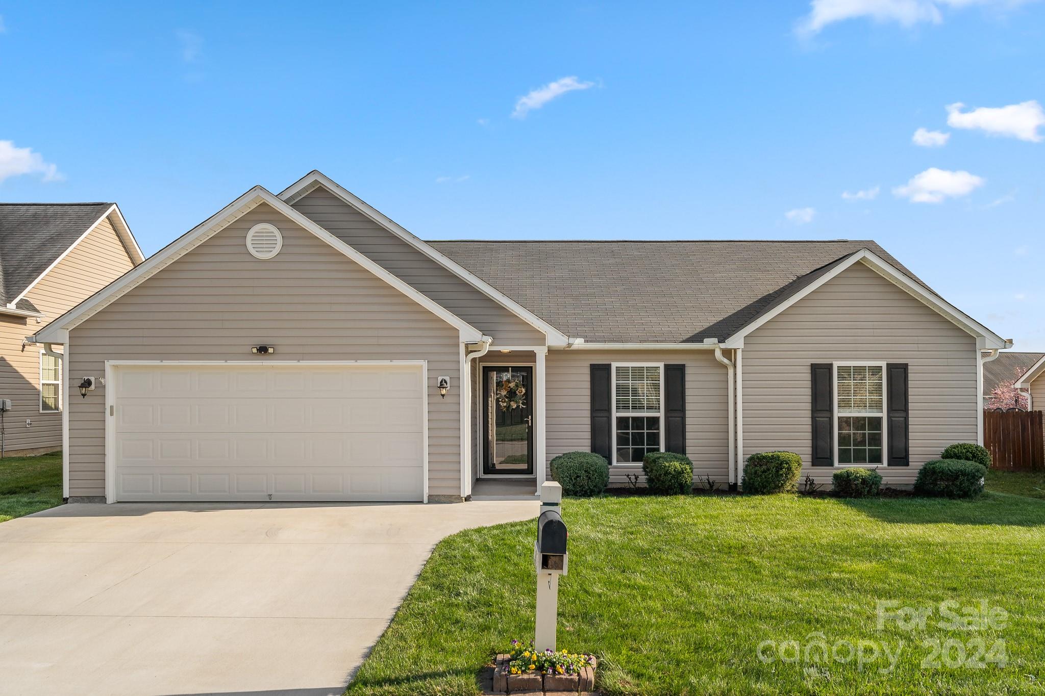 290 West Swift Creek Road Fletcher, NC 28732 - Photo 1 of 33 a front view of a house with a yard