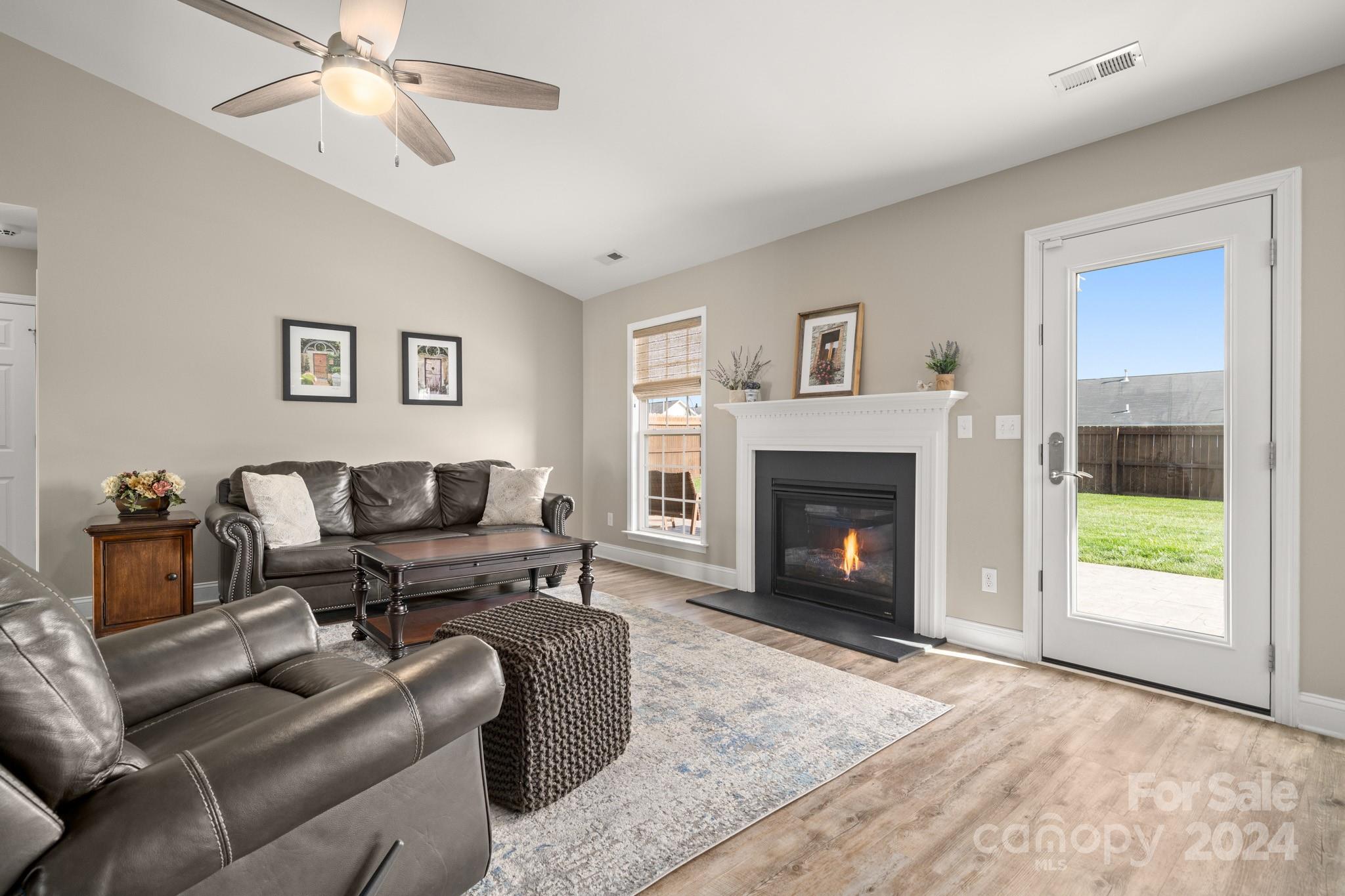 290 West Swift Creek Road Fletcher, NC 28732 - Photo 3 of 33 a living room with furniture and a fireplace